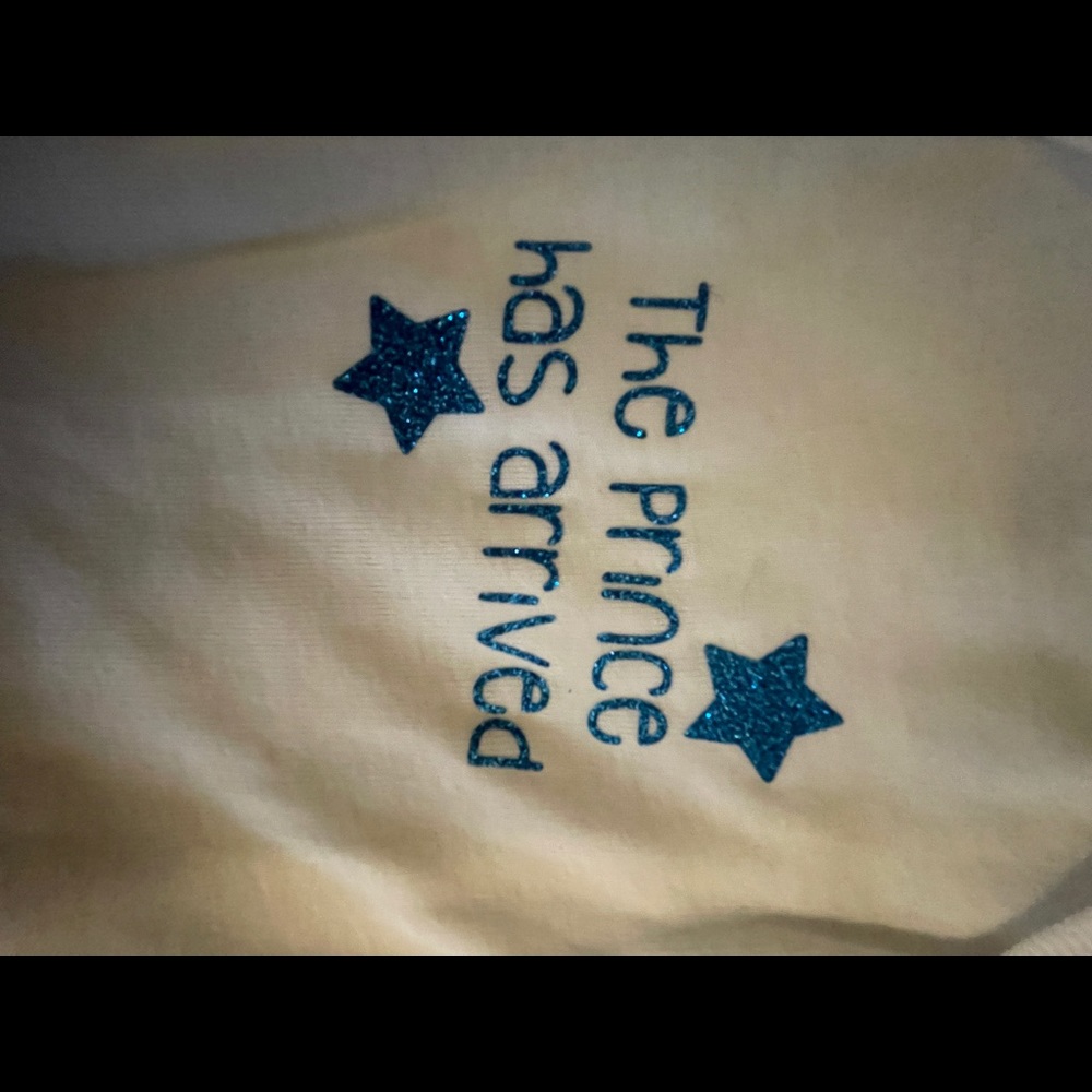 Baby onesies “the prince has arrived”.